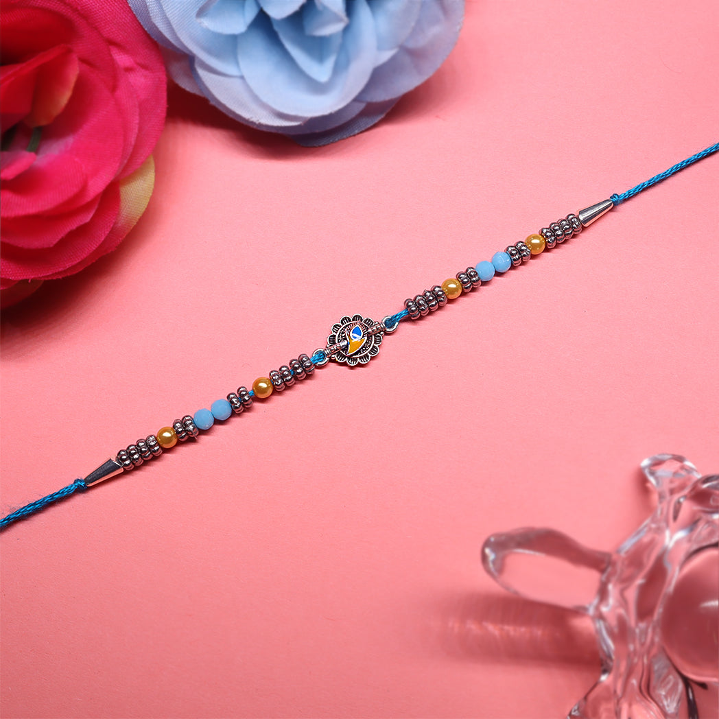 Enamel Heritage Rakhi Set – Crown, Mandala & Peacock-Inspired Charms ( Set of 3)