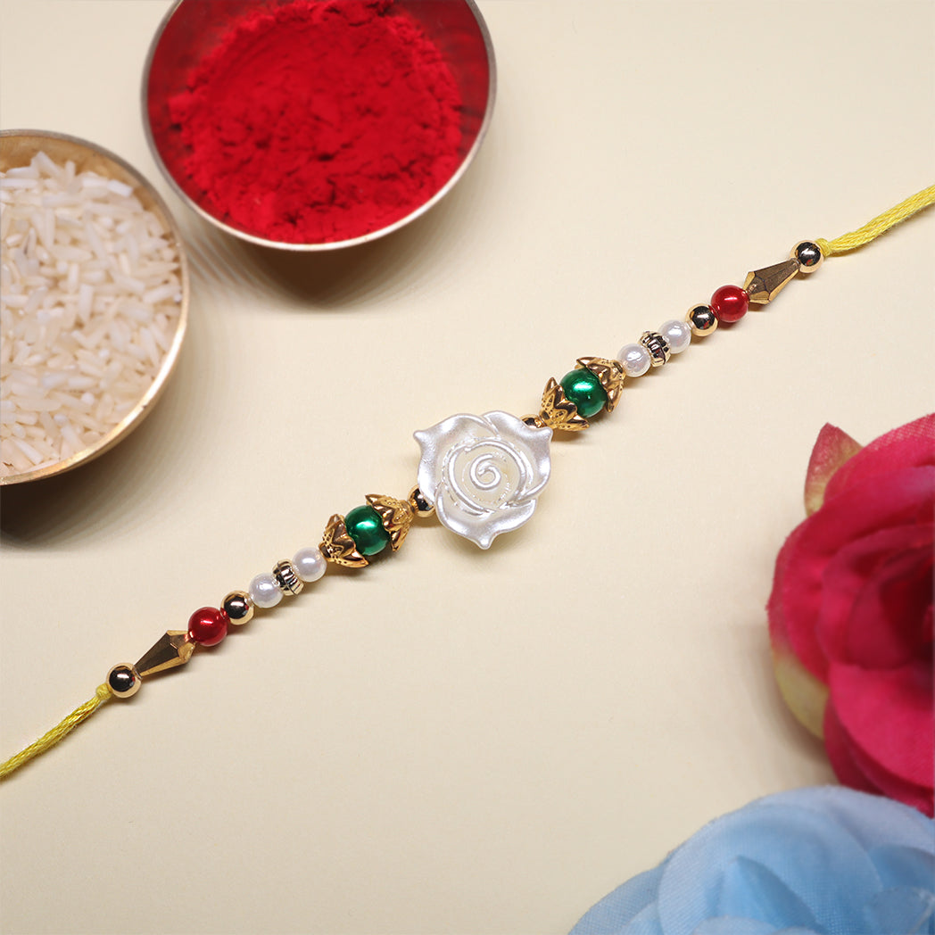 Festive Grace Rakhi Trio – Ganpati, Floral & Beaded Combo (Set of 3)
