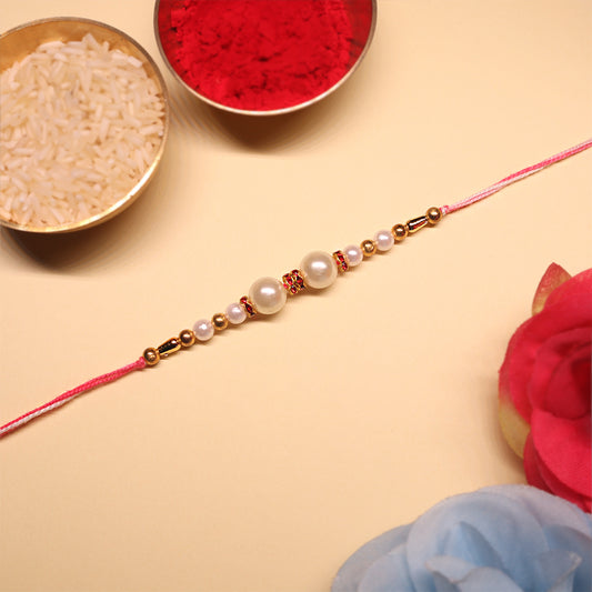 Grace & Glow Rakhi Trio – Golden Bloom, Pearl Blush & Pink Radiance