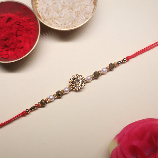Swarna Sutra Rakhi Set – A Sacred Pair of Golden Radiance & Divine Grace (Set of 2)