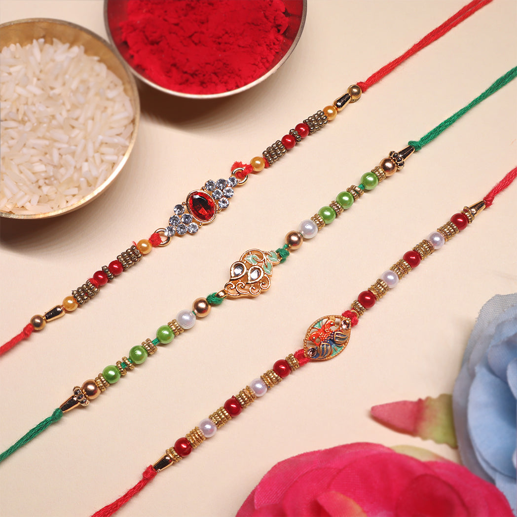 Elegant Elements Rakhi Set – Kundan Red, Royal Green & Artistic Enamel
