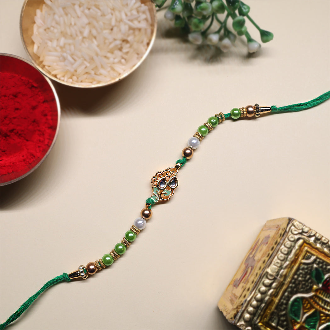 Elegant Elements Rakhi Set – Kundan Red, Royal Green & Artistic Enamel