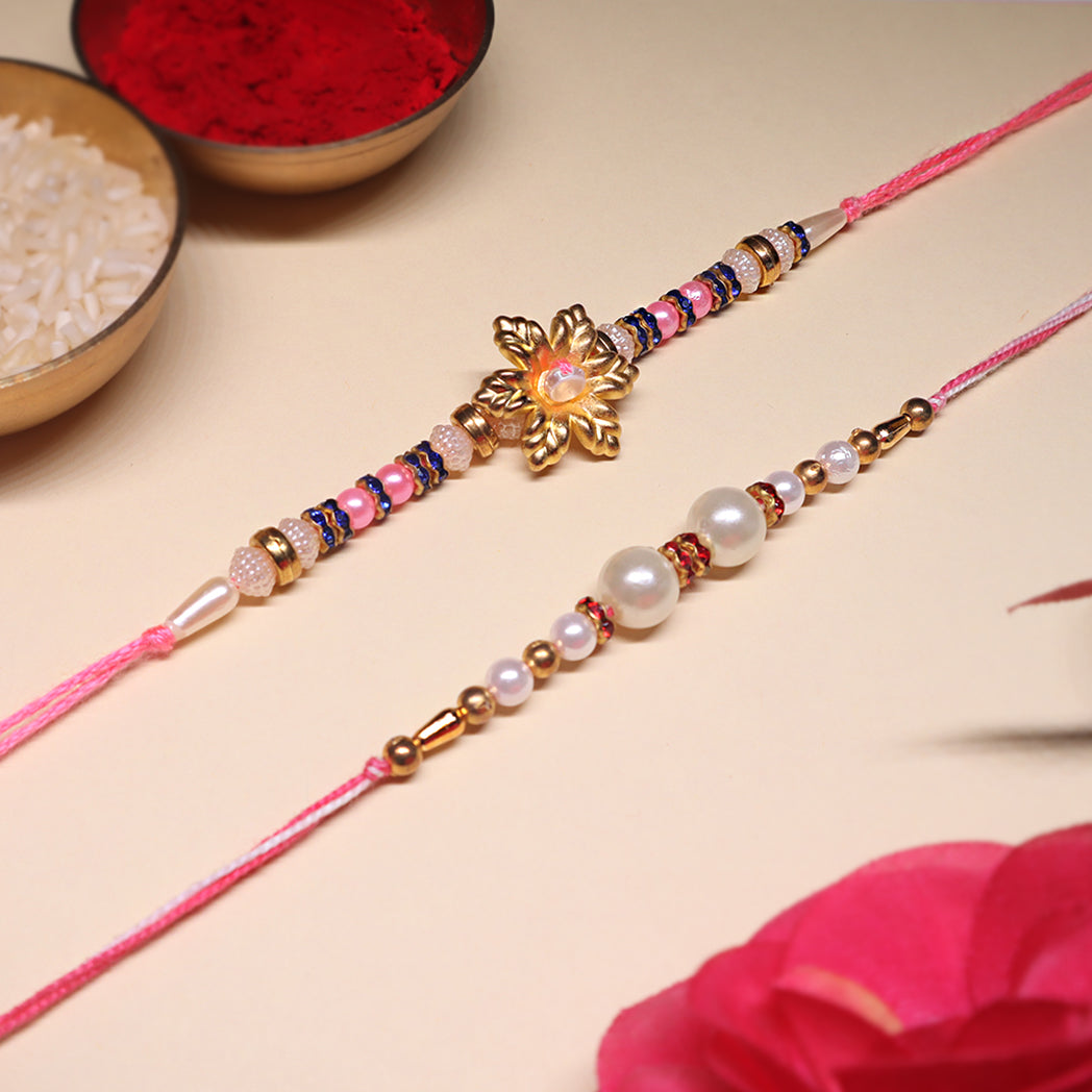 Grace & Glow Rakhi Trio – Golden Bloom, Pearl Blush & Pink Radiance