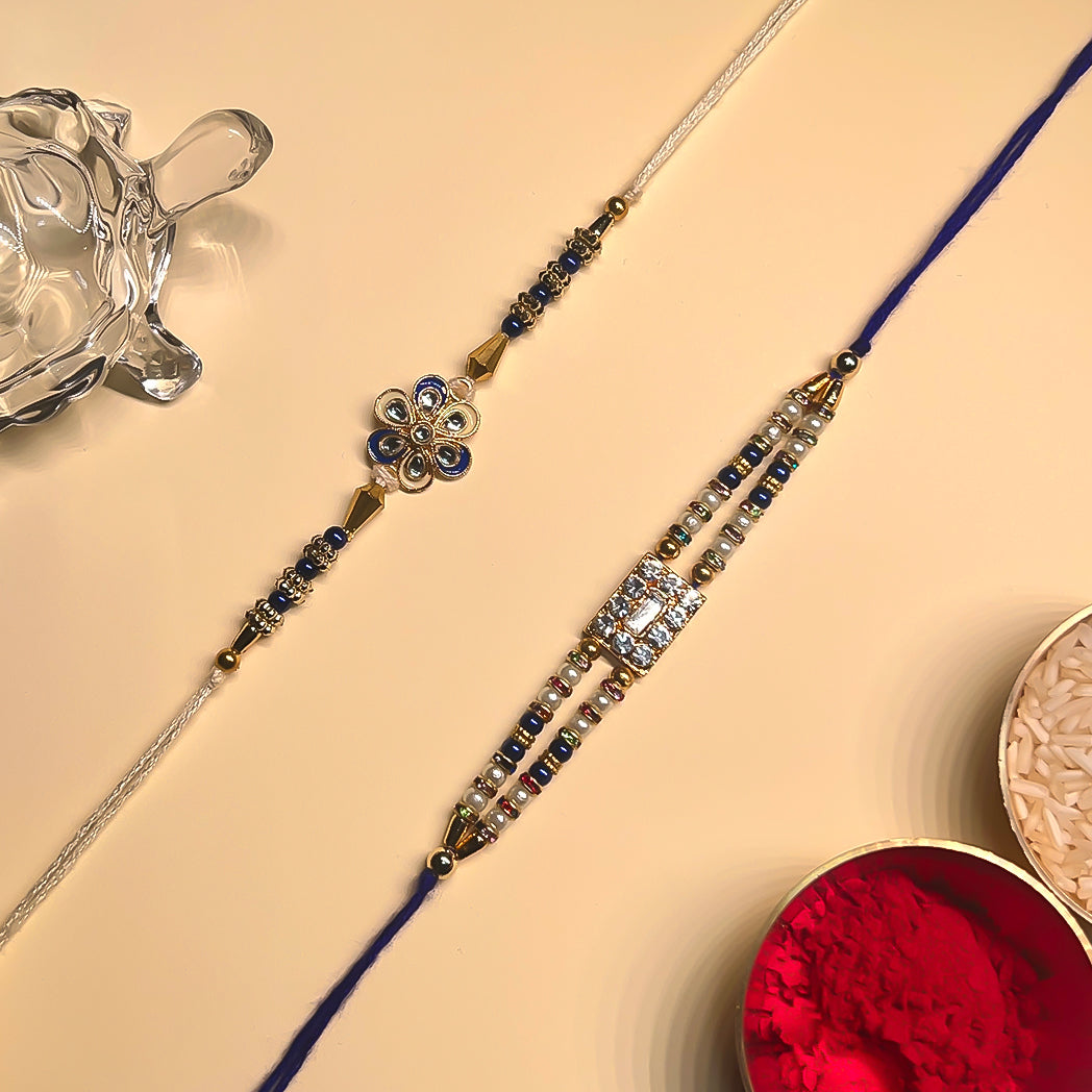 Royal Blue Rakhi Duo – Crystal & Meenakari Charm Set (Set of 2)