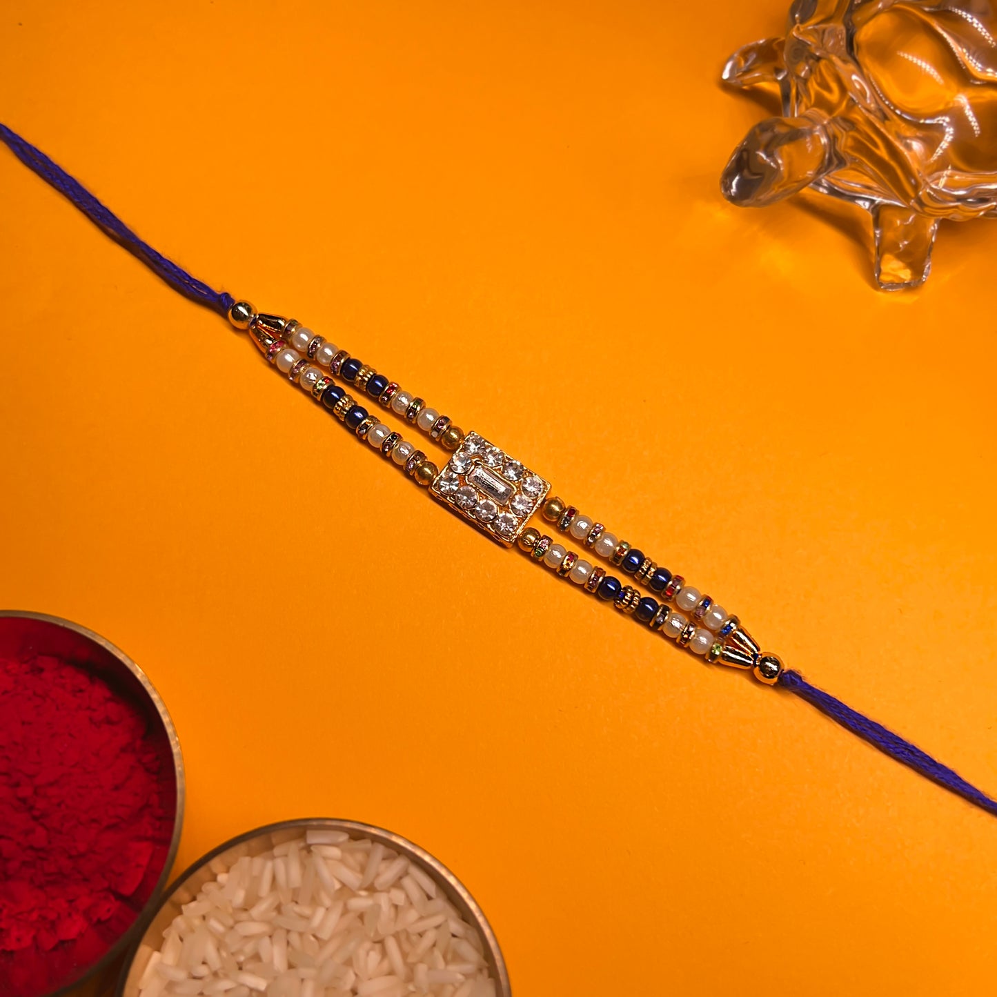 Royal Blue Rakhi Duo – Crystal & Meenakari Charm Set (Set of 2)