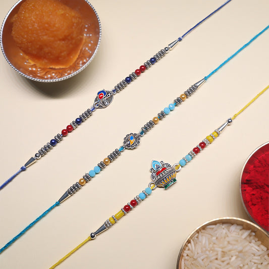 Enamel Heritage Rakhi Set – Crown, Mandala & Peacock-Inspired Charms ( Set of 3)