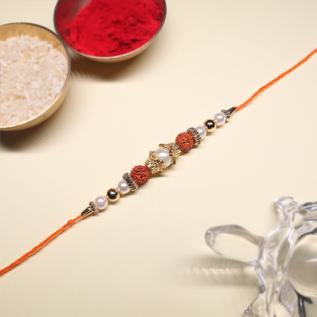 Rudraksha & Pearl Rakhi Combo – Sacred Threads of Protection