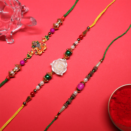 Festive Grace Rakhi Trio – Ganpati, Floral & Beaded Combo (Set of 3)