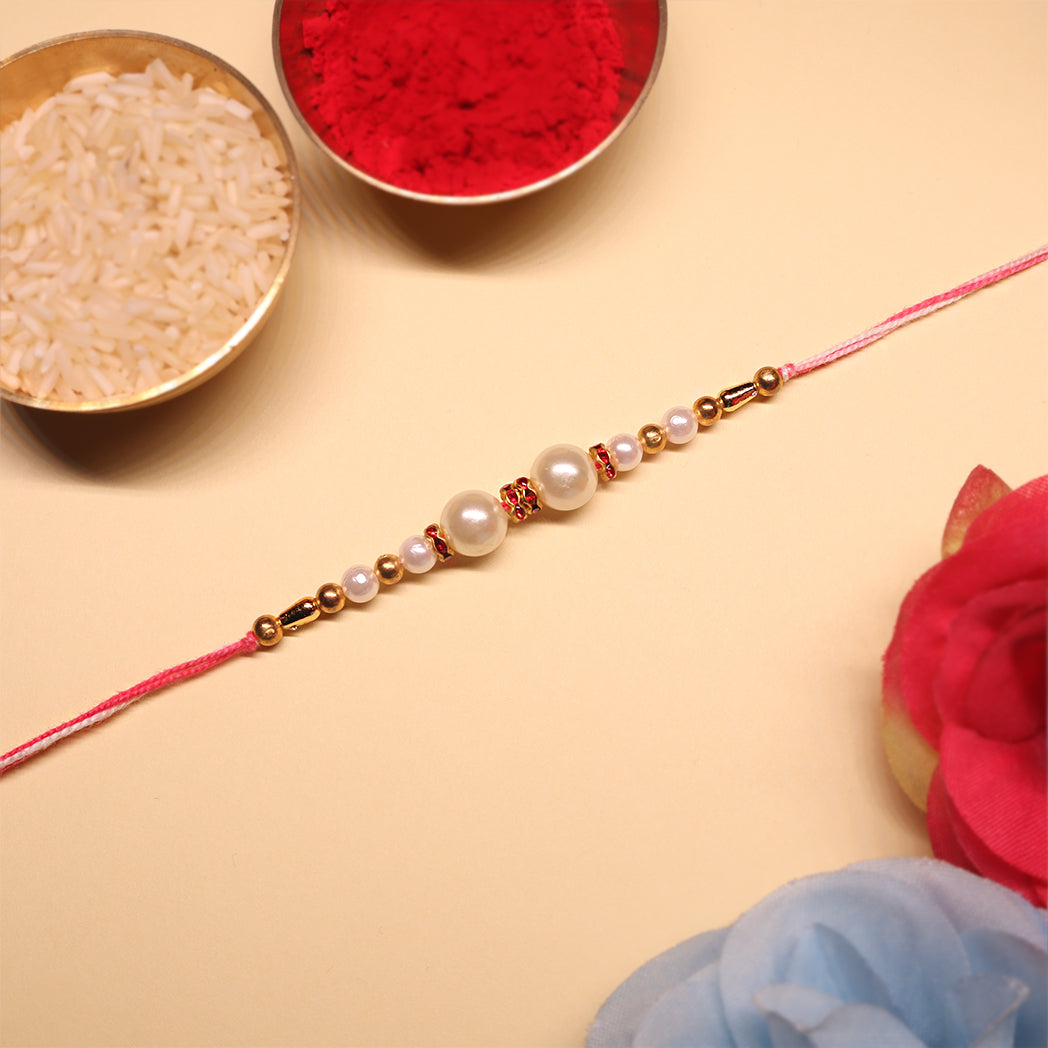 Pink Harmony Rakhi Set – Classic Pearl & Evil Eye Beaded Combo (Set of 2)