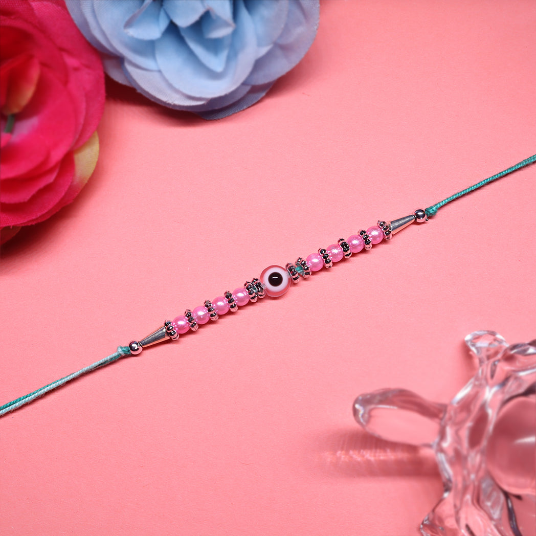 Pink Harmony Rakhi Set – Classic Pearl & Evil Eye Beaded Combo (Set of 2)
