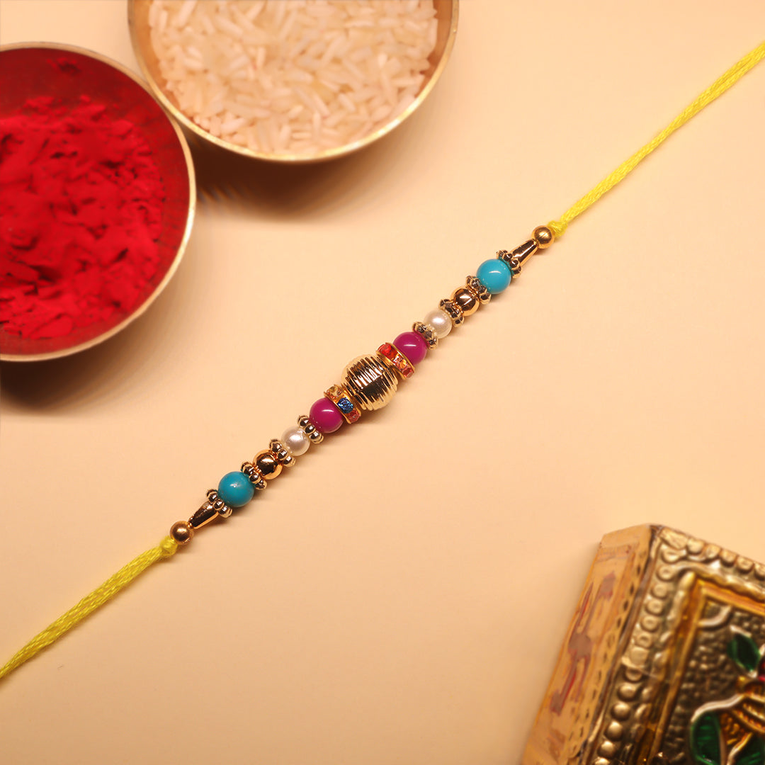 Golden Harmony Rakhi Set – A Duo of Tradition, Color & Festive Elegance