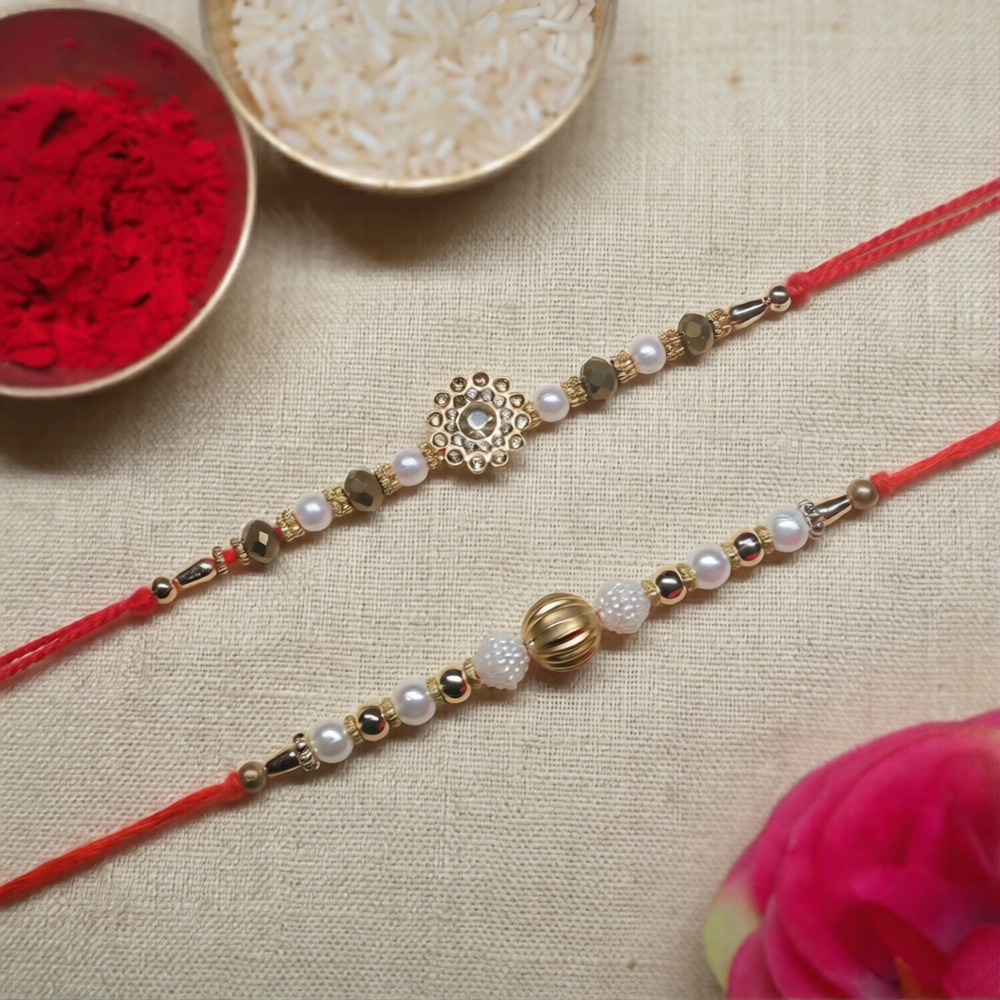 Swarna Sutra Rakhi Set – A Sacred Pair of Golden Radiance & Divine Grace (Set of 2)