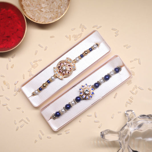 Festive Petals Rakhi Combo – A Twin Sparkle of Gold, Blue & Floral Elegance for Raksha Bandhan
